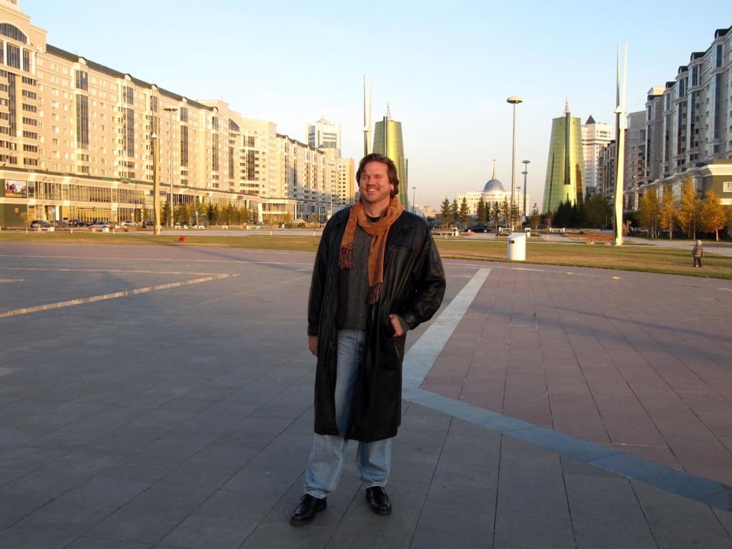 Dave on the main plaza It's pretty chilly here; not snowing yet, but it's thinking about it - thus the heavy clothes. Also, behind me is the new Presidential Palace.