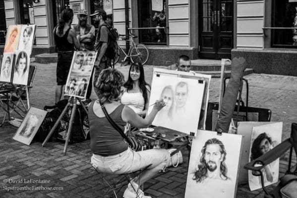 Russian street artists are watched by the work
