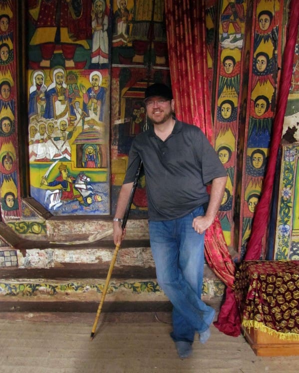 dave lafontaine posing with the crutch-chairs in the bahir dar monasteries 